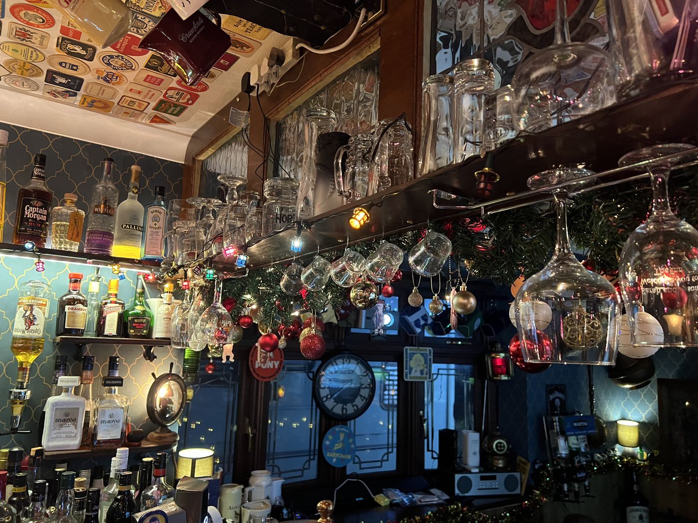 Another angle of The Inn with vintage signs and hanging tankards